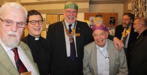 Willie Fraser, Club President, with Lea Williams, Assistant Curate of St Mary's Church, and other Rotary members.